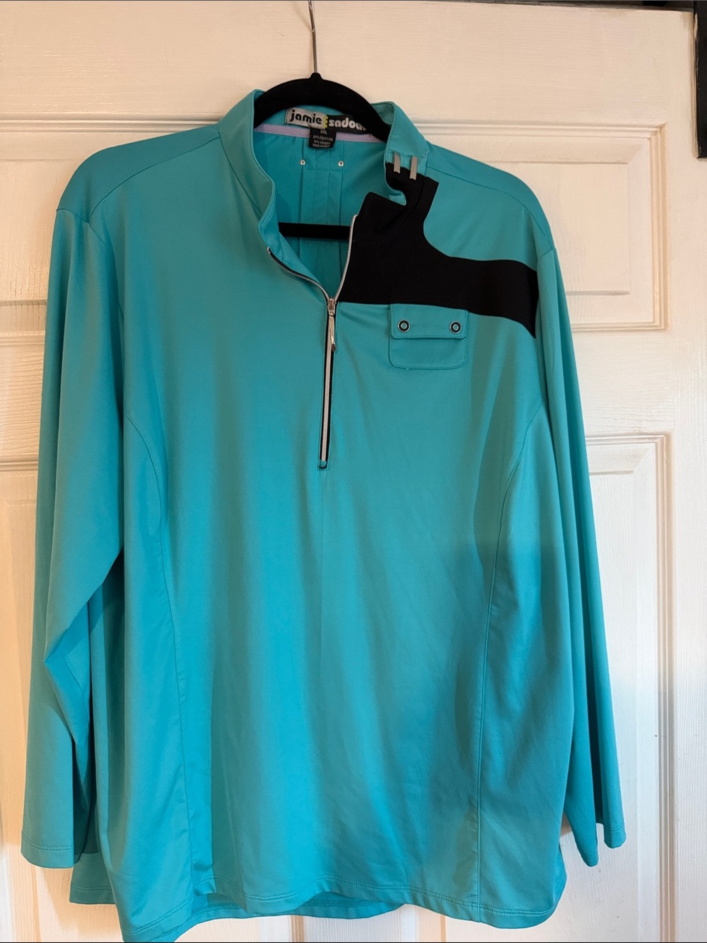 jamie sadock turquoise performance pullover with black trim